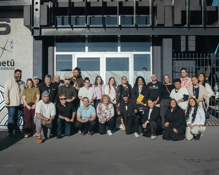 Drua Executive members group photo in front of Drua banner