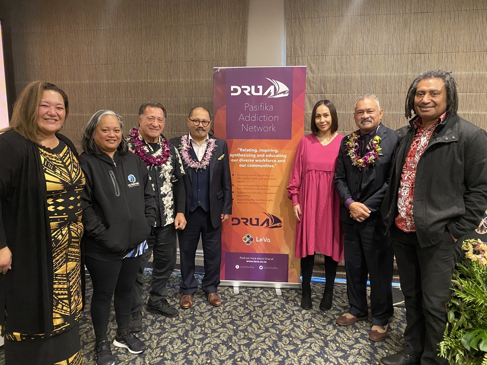 Drua Executive members group photo in front of Drua banner